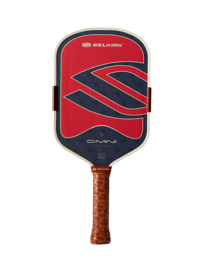 The Selkirk OMNI Elongated 16mm Pickleball Paddle features a red, blue, and black face with a large "S" logo and a brown textured grip.