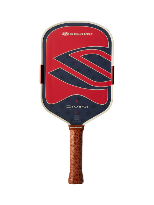 The Selkirk OMNI Elongated 16mm Pickleball Paddle features a red, blue, and black face with a large "S" logo and a brown textured grip.