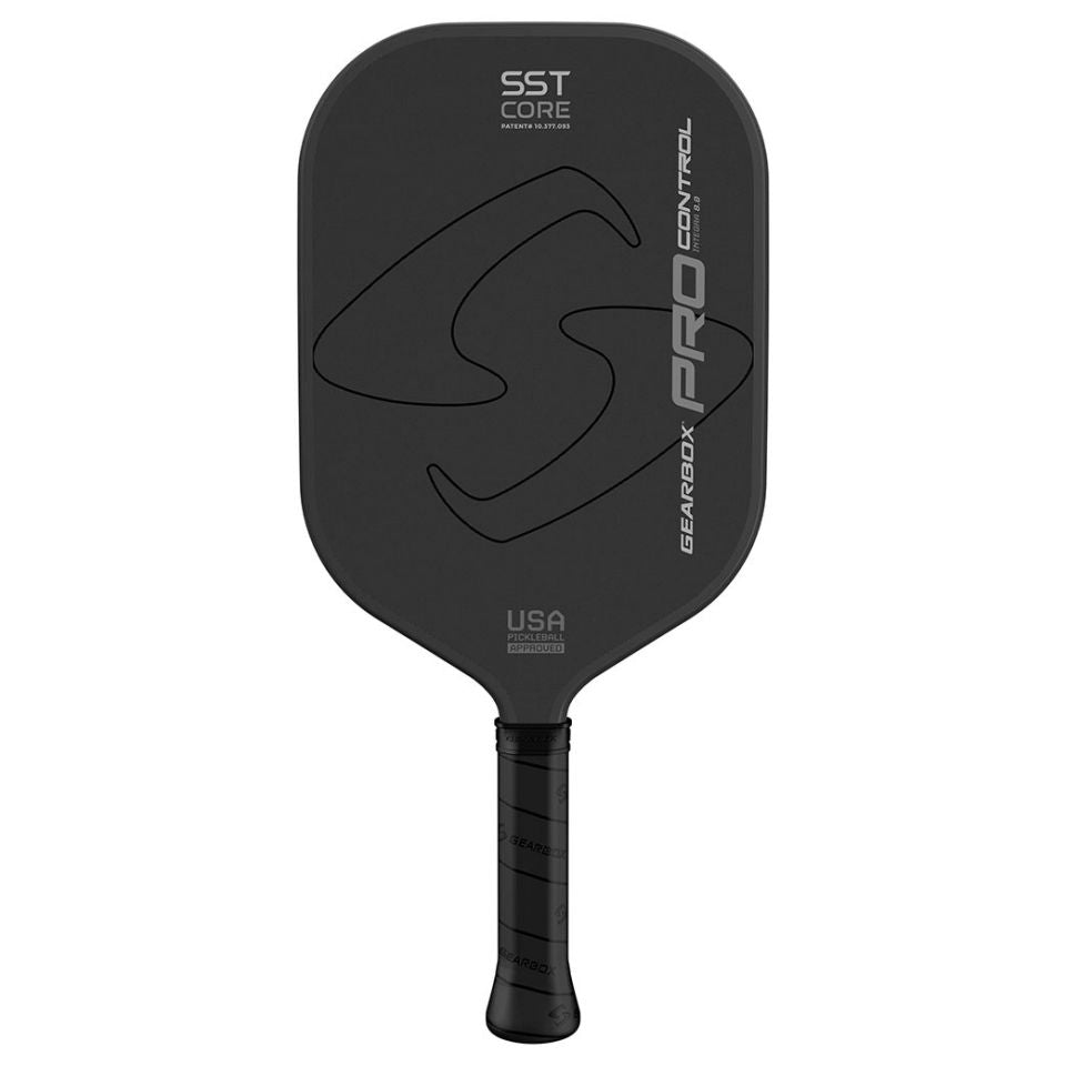 A Gearbox Pro Control Integra Pickleball Paddle with the brand name "Gearbox" and model "Pro Control" printed on the face, featuring SST core technology and a carbon fiber framework. The handle is wrapped in black grip tape.