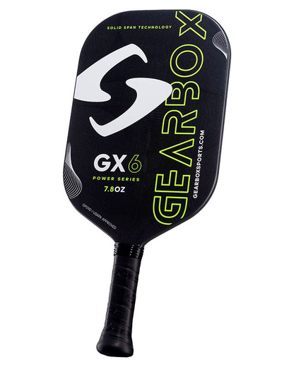 A black and yellow Pickleballist GX6 pickleball paddle featuring prominent branding and the text "Solid Span Technology" and "7.8oz.