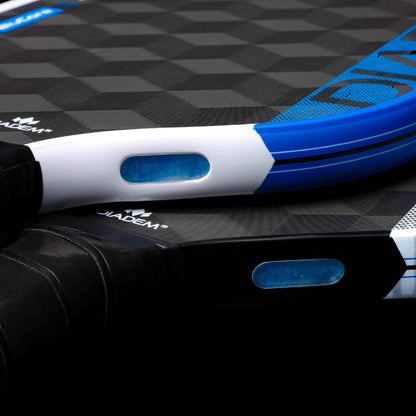 Close-up product description of two Diadem Edge BluCore Hybrid 14mm Pickleball Paddles stacked together, showcasing their black and blue textured surfaces and distinctive oval cutout details.