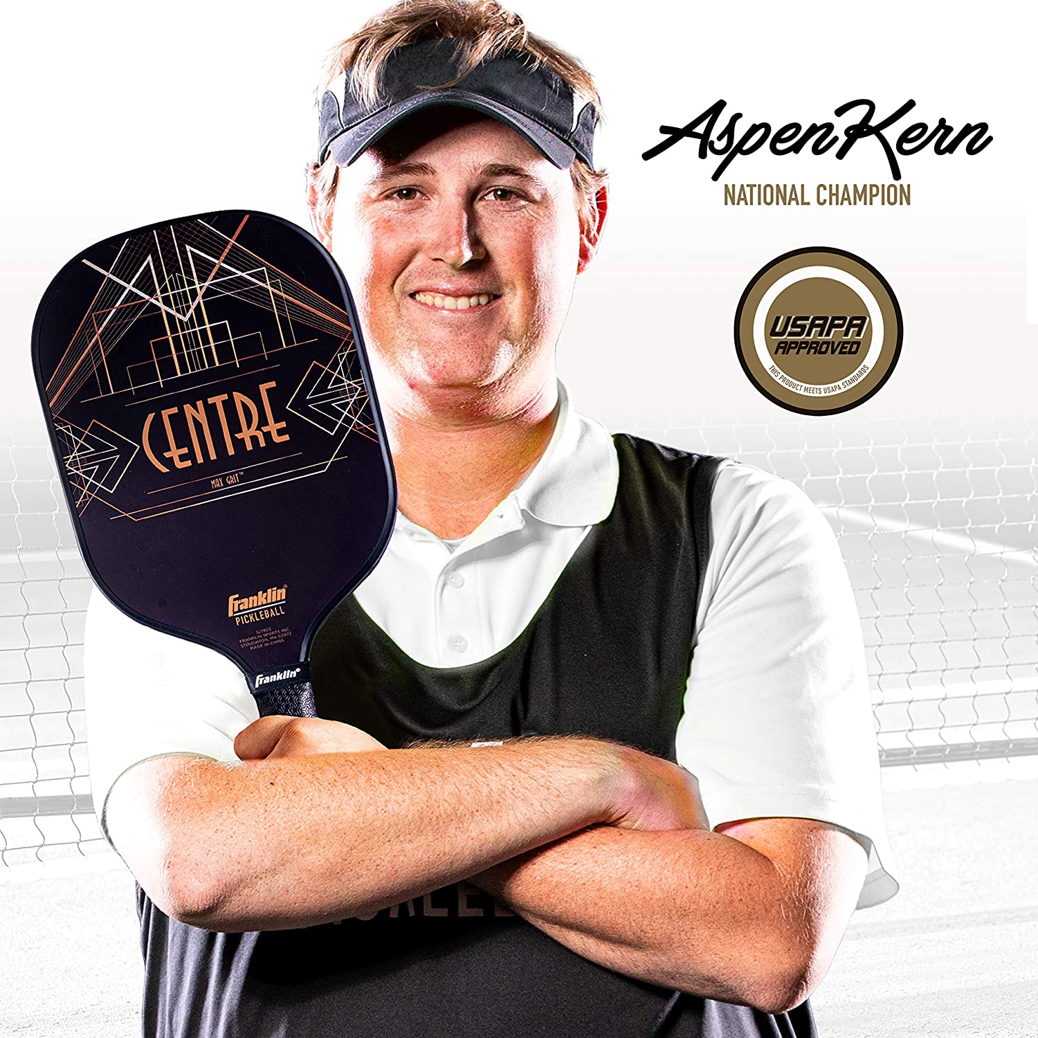 A man holding a Franklin Aspen Kern Centre Carbon Fiber Pickleball Paddle in front of a tennis court, showcasing spin rate.