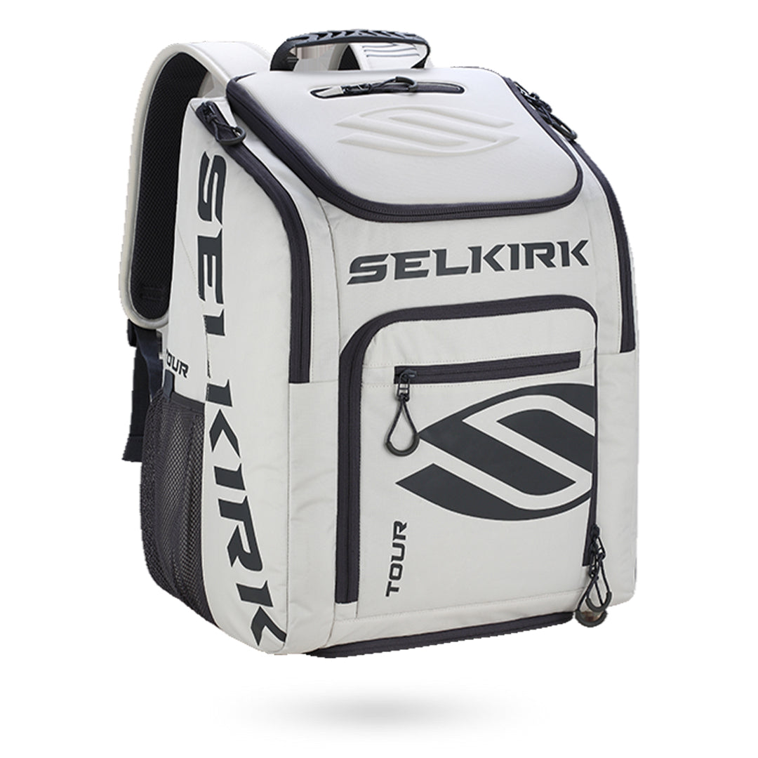 A white and black Selkirk Tour Backpack (2022) Pickleball Bag with the word Selkirk on it.