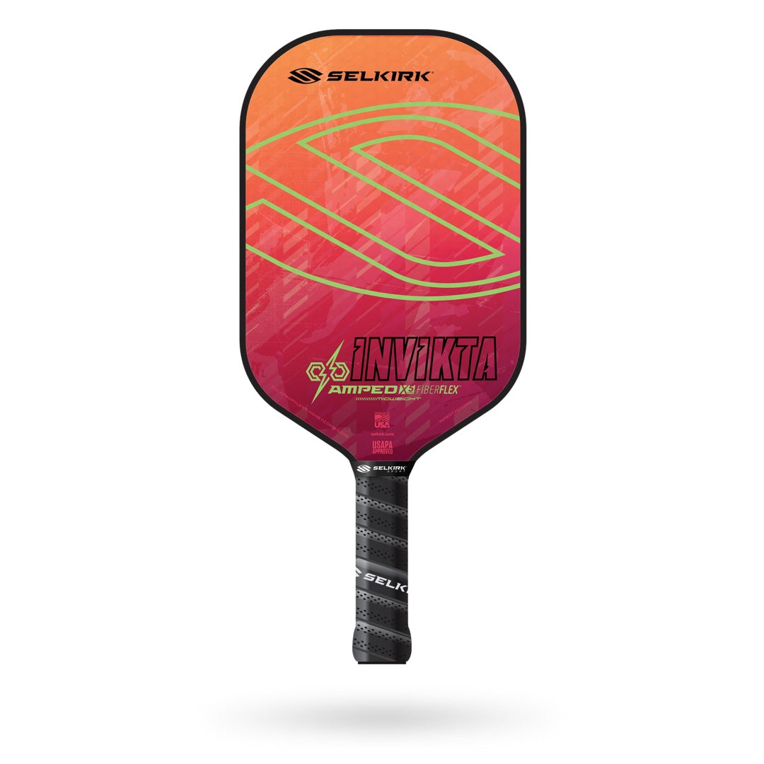 A Selkirk Amped Invikta Pickleball Paddle with a pink and gold design on it.