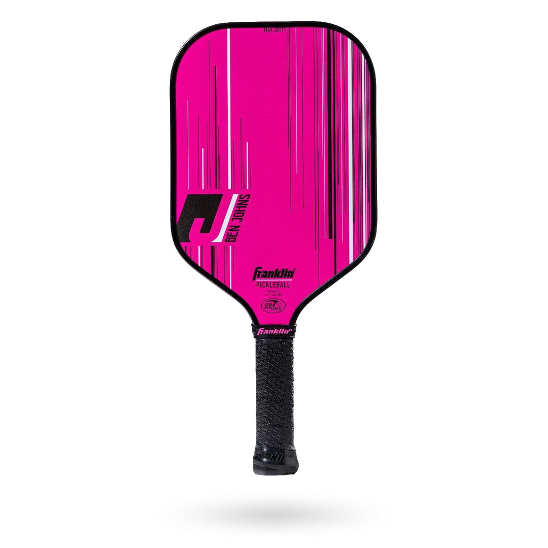A pink paddle with black stripes on it.