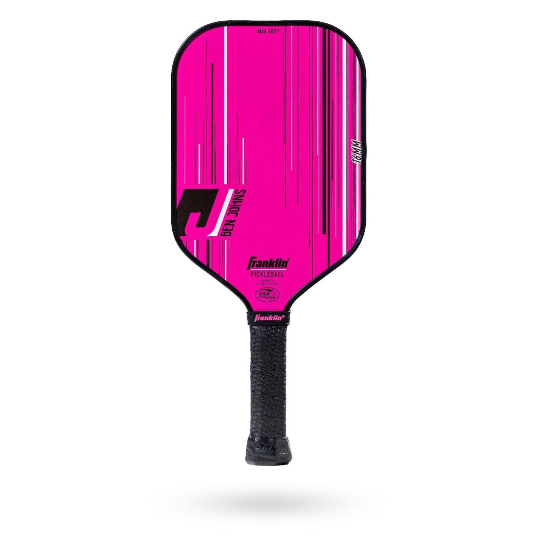 A pink paddle with black stripes on it.